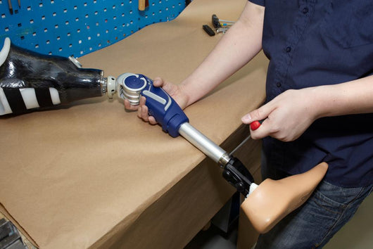 Technician Adjusts Prosthetic Foot