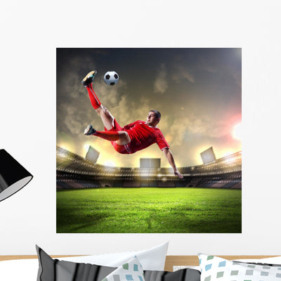 Football Player Striking Ball shown on a wall