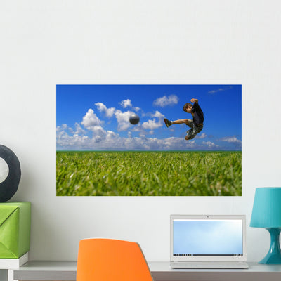 Boy Playing Soccer Clipping Wall Mural shown on a wall