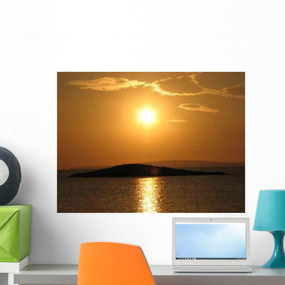 Sunset Over a Lake Wall Decal shown on a wall