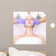 Young woman receiving beauty therapy Wall Mural