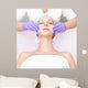 Young woman receiving beauty therapy Wall Mural