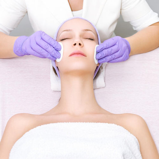 Young woman receiving beauty therapy Wall Mural