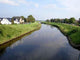 River Cutting Through Small Town Wall Decal