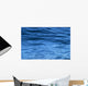 beautiful calm ripples on deep blue ocean on a bright sunny day Wall Mural