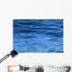 beautiful calm ripples on deep blue ocean on a bright sunny day Wall Mural