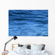 beautiful calm ripples on deep blue ocean on a bright sunny day Wall Mural