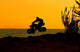 Quad Bike Jumping on Beach at Sunset Wall Mural