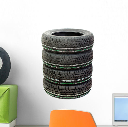 Four new tires stacked on white background Wall Decal