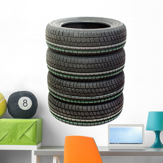 Four new tires stacked on white background Wall Decal