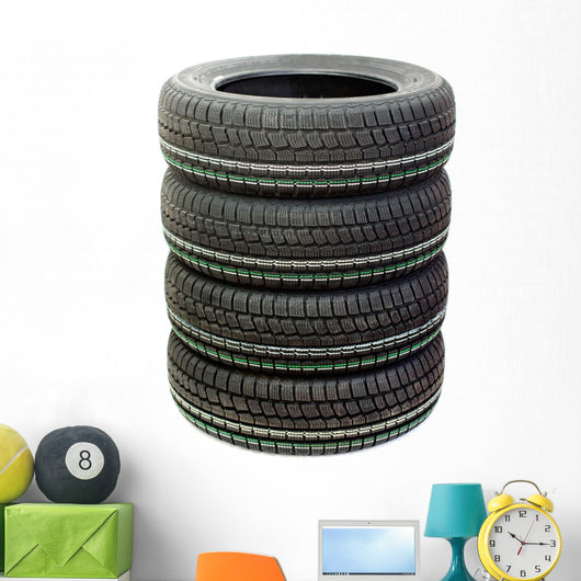 Four new tires stacked on white background Wall Decal