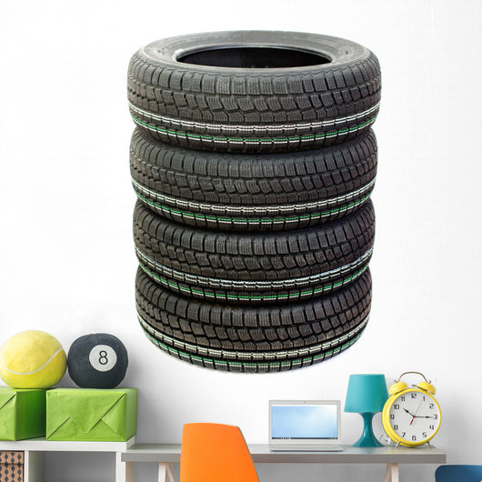 Four new tires stacked on white background Wall Decal