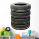 Four new tires stacked on white background Wall Decal