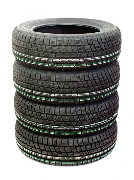 Four new tires stacked on white background Wall Decal