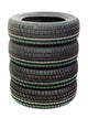 Four new tires stacked on white background Wall Decal