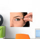 Close up look of applying eyeshadow with applicator Wall Mural