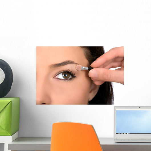 Close up look of applying eyeshadow with applicator Wall Mural