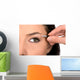 Close up look of applying eyeshadow with applicator Wall Mural