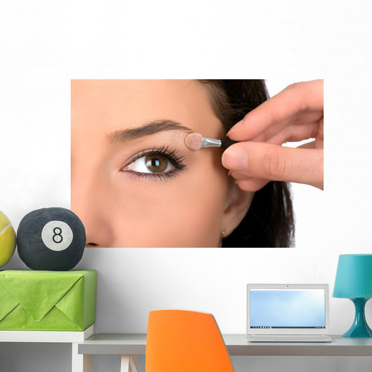 Close up look of applying eyeshadow with applicator Wall Mural
