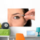 Close up look of applying eyeshadow with applicator Wall Mural
