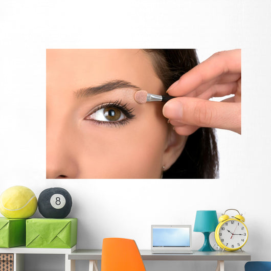 Close up look of applying eyeshadow with applicator Wall Mural