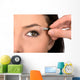 Close up look of applying eyeshadow with applicator Wall Mural