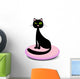 Elegant black cat sitting on a pink pillow Wall Decal