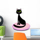 Elegant black cat sitting on a pink pillow Wall Decal