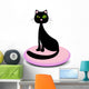 Elegant black cat sitting on a pink pillow Wall Decal