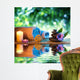 two candles and towels black stones and purple daisy on water Wall Mural