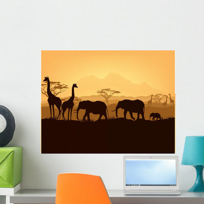 African Animals Silhouettes Sunset Wall Mural shown on a wall