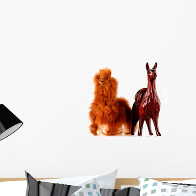 Toy Llamas with Real shown on a wall