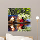 candles, towels, stones and almond flowers in water Wall Mural