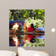 candles, towels, stones and almond flowers in water Wall Mural