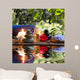 candles, towels, stones and almond flowers in water Wall Mural