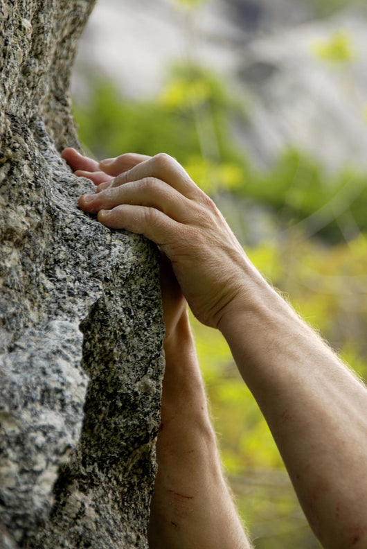 hands on the rocks Wall Mural
