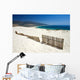 Fence Sticking Out of Sandy Beach Dunes Wall Mural