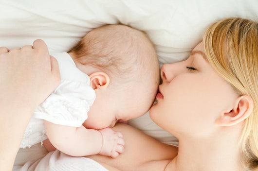 Mother Breast Feeding Her