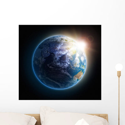 Sunrise over Earth shown on a wall