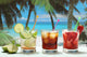 alcohol cocktails with fruits on white exotic sea Wall Mural
