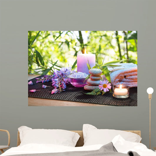massage in the bamboo garden with violet flowers, candles Wall Mural