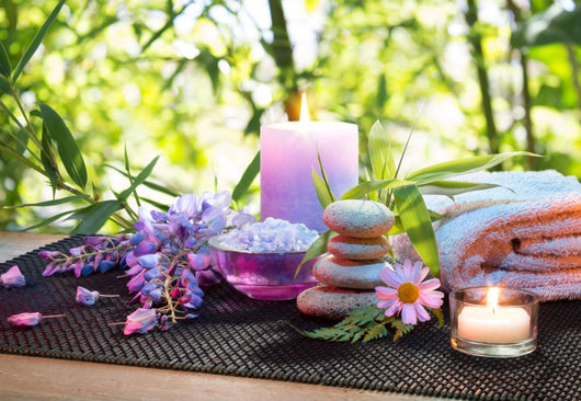 massage in the bamboo garden with violet flowers, candles Wall Mural