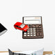 Toy car and calculator over white Wall Decal
