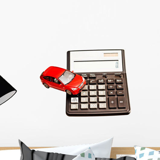 Toy car and calculator over white Wall Decal