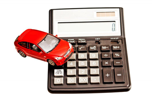 Toy car and calculator over white Wall Decal