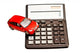 Toy car and calculator over white Wall Decal