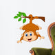 Cute monkey hanging on a tree branch Wall Decal