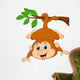 Cute monkey hanging on a tree branch Wall Decal