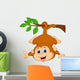 Cute monkey hanging on a tree branch with thumb up Wall Decal