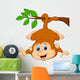 Cute monkey hanging on a tree branch with thumb up Wall Decal